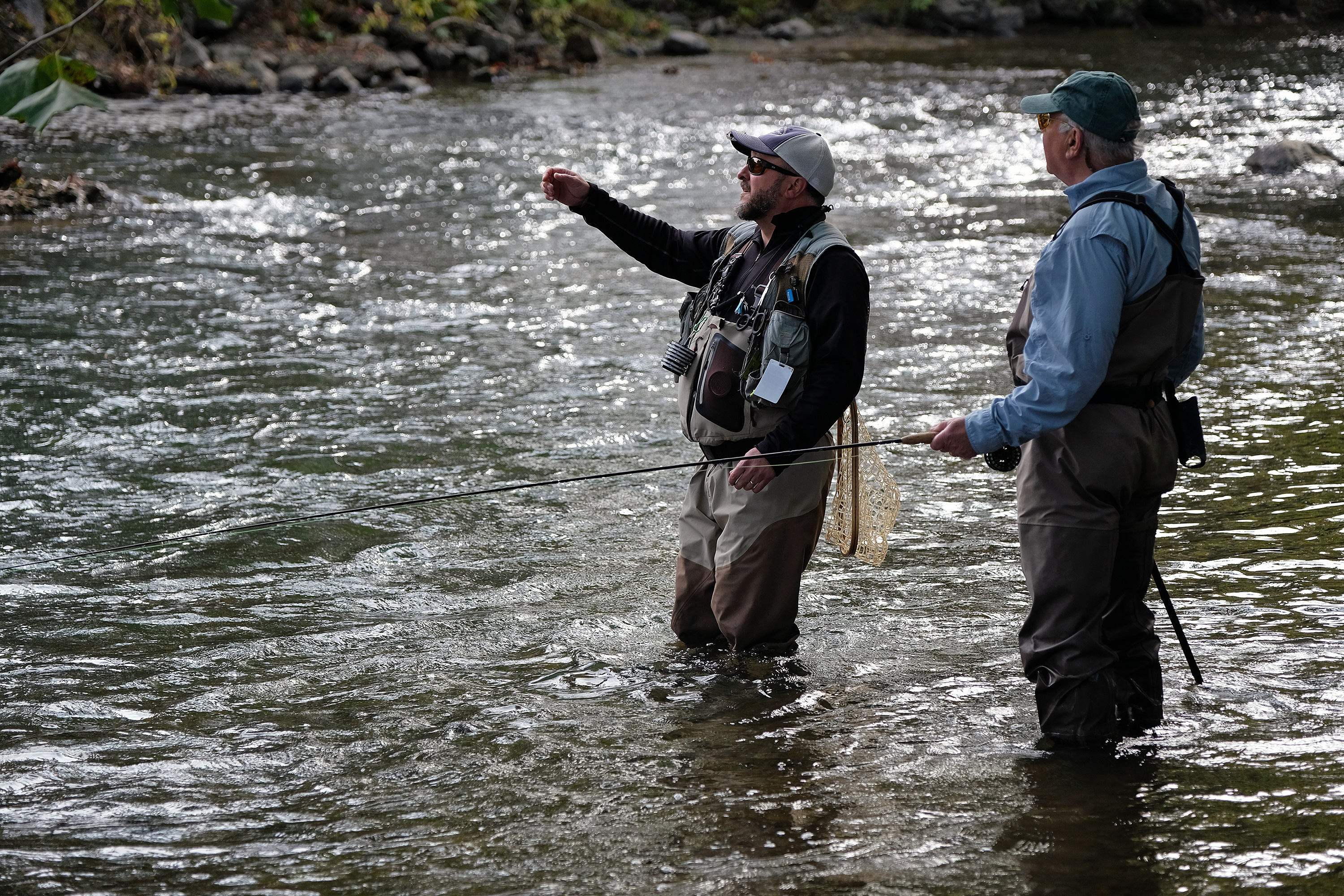 Tommy Lawhorne works with Robert Dillard, of Winston Salem, N.C. during a guided fishing trip on the South River South River in Waynesboro, Va., Friday, Oct. 14, 2016. (Photo by Norm Shafer).